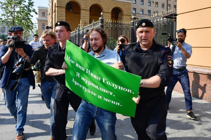 Moscow police detain a supporter of journalist Ivan Golunov who on Saturday was charged with dealing in a "large amount" of illegal drugs, accusations his supporters say have been fabricated so as to stop his work