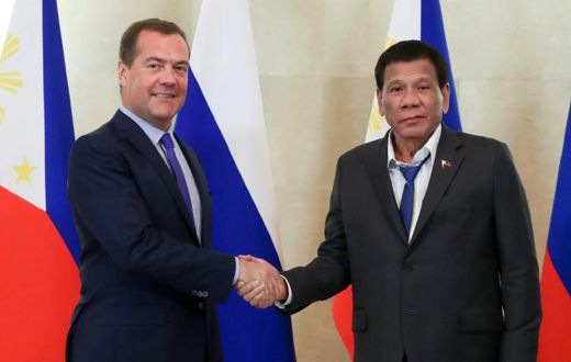 A spokesman for Philippine leader Rodrigo Duterte (right) defended his dishevelled appearance at a meeting with Russian Prime Minister Dmitry Medvedev (left) in Moscow