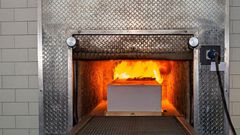 A coffin being cremated