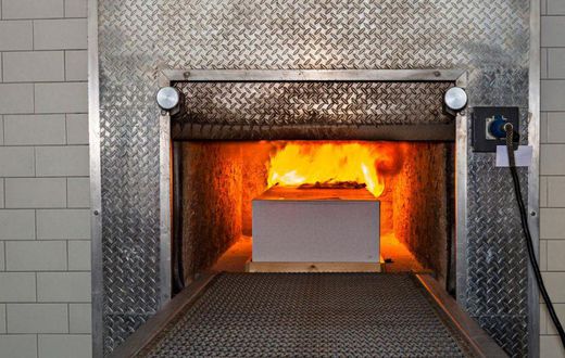 A coffin being cremated