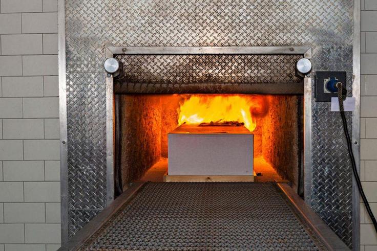 A coffin being cremated