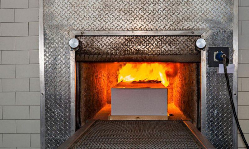 A coffin being cremated