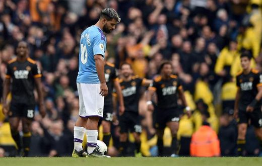 Shocked Sergio: Sergio Aguero looks on as Wolves celebrate their second goal in a 2-0 win over Manchester City