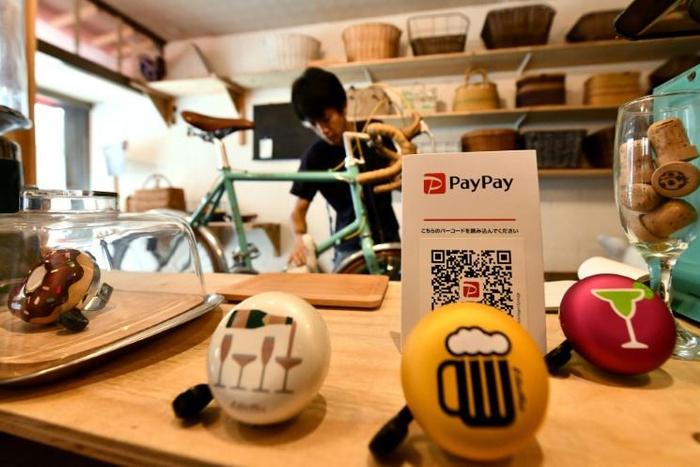 Only 'two or three' people a week use the PayPay system at Katsuyuki Hasegawa's bike repair shop