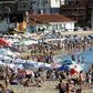 (FILES) In this file photo taken on January 16, 2019, tourists enjoy the sun at La Mansa beach in Punta del Este, Uruguay; Worldwide destinations received 671 million foreign visitors between January and June