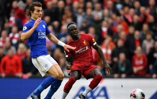 Senegalese Sadio Mane (R) scores for Liverpool against Leicester City at Anfield