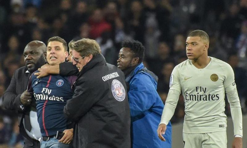 He only wanted a picture: the fan who ran on the field to take a selfie with Kylian Mbappe has been fined and banned