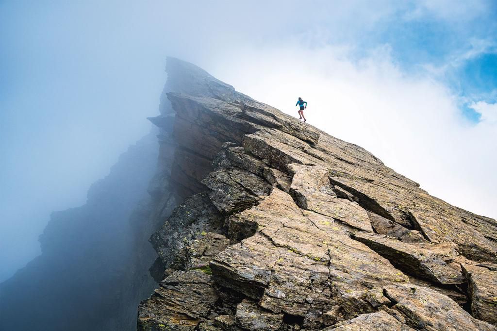 Kimberly Strom running in the Swiss Alps.
