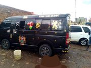 Matatu bearing photo of DP William Ruto in Commander-in-Chief uniform and Kenyan Coat of Arms (Twitter)