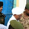 Ousted Sudanese leader Omar al-Bashir who appeared in court Monday for the start of his trial on corruption charges is seen in this June 2019 picture being escorted from the Kober prison to the prosecutor's office in North Khartoum