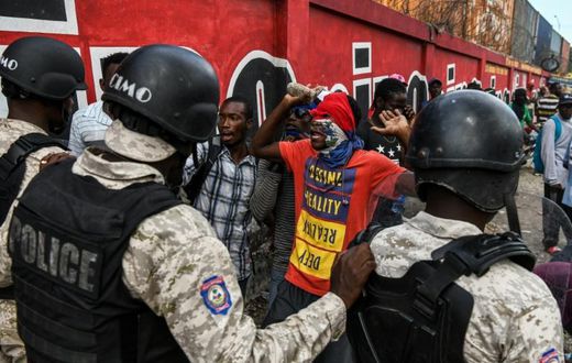 Protesters demanding the resignation of Haitian President Jovenel Moise face off with police in Port-au-Prince on October 4, 2019, as public anger simmers
