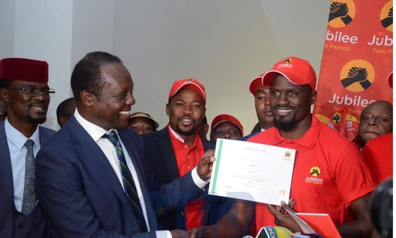 Jubilee’s McDonald Mariga the party’s nnation certificate from party Secretary General Raphael Tuju