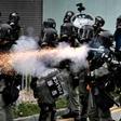 Riot police used tear gas throughout the afternoon and evening in Yuen Long after tense standoffs with protesters, some of whom were throwing projectiles and had surrounded a police van