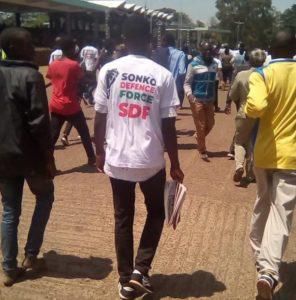 Young person in t-shirt reading; “Sonko Defence Force”
