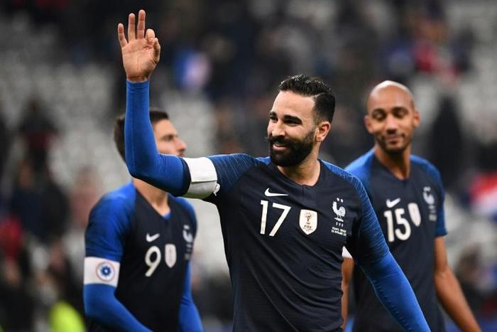 Marseille defender Adil Rami, shown playing for France, has been sacked by the club, reportedly for 'gross misconduct'