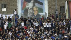 Spectators watch a match between Palestinian team Hilal al-Quds and Morocco's Raja Casablanca -- the first Moroccan football team to play in the occupied Palestinian territories on October 3, 2019