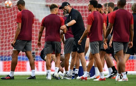 Jurgen Klopp with his players as they trained at the Metropolitano Stadium on Friday