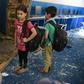 Afghan children stand in the debris at a school near the site of a Taliban car bomb attack in Kabul on July 2, 2019, a day after the deadly blast at the Defense Ministry's logistics centre that also damaged nearby buildings.At least six people were kil...
