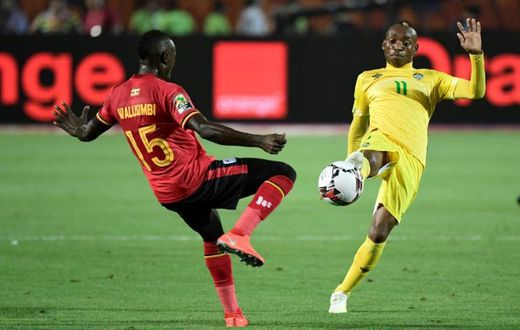 A file photo of star Zimbabwe forward Khama Billiat (R) playing against Uganda during the 2019 Africa Cup of Nations in Egypt