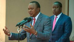 File image of interior CS Fred Matiangi with President Uhuru Kenyatta
