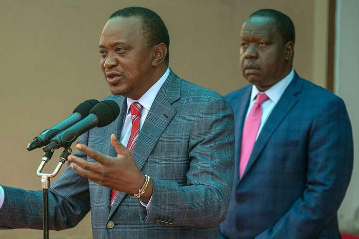 File image of interior CS Fred Matiangi with President Uhuru Kenyatta