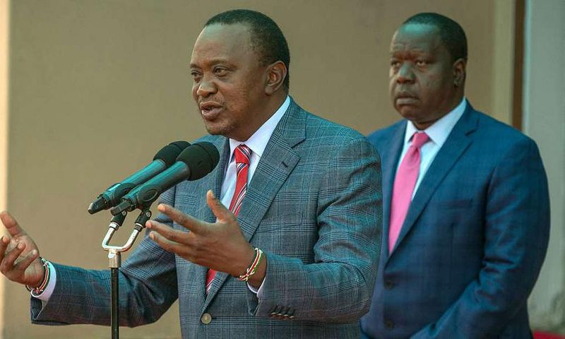 File image of interior CS Fred Matiangi with President Uhuru Kenyatta
