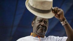 Special AU envoy Raila Odinga gives his trademark salute for the dead for 8 pupils who died at Precious Talents School