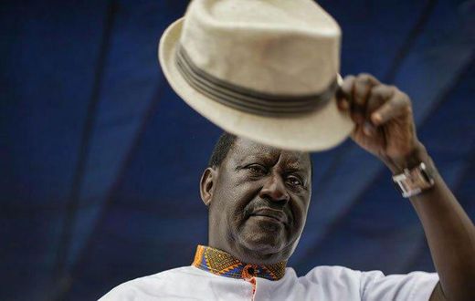 Special AU envoy Raila Odinga gives his trademark salute for the dead for 8 pupils who died at Precious Talents School