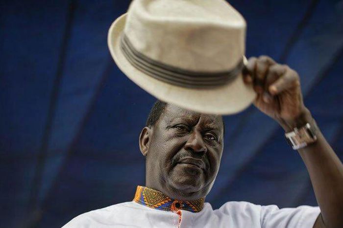 Special AU envoy Raila Odinga gives his trademark salute for the dead for 8 pupils who died at Precious Talents School