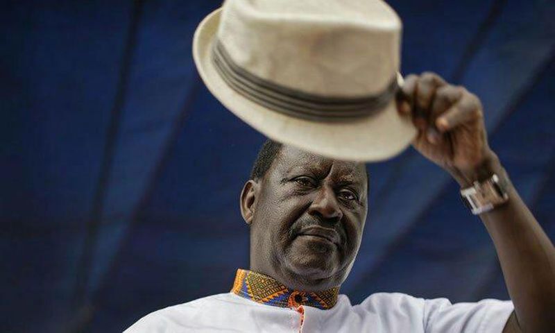 Special AU envoy Raila Odinga gives his trademark salute for the dead for 8 pupils who died at Precious Talents School
