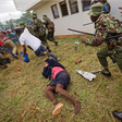 Supporters of President Uhuru Kenyatta engage in rock-throwing clashes with police at his inauguration ceremony after trying to storm through gates to get in and being tear-gassed, at Kasarani stadium in Nairobi, Kenya.