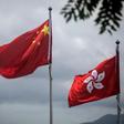 China's national flag is seen beside the Hong Kong ensign a day after protesters broke into the government headquarters in the city