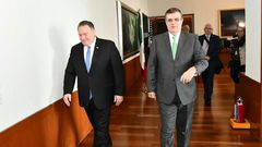Mexico's Foreign Secretary Marcelo Ebrard (R) walks with US Secretary of State Mike Pompeo before a meeting in Mexico City that focused on slowing northward migration