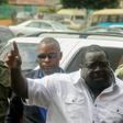 A leading critic of President Edgar Lungu, Chishimba Kambwili (C), has been arrested for defaming the president