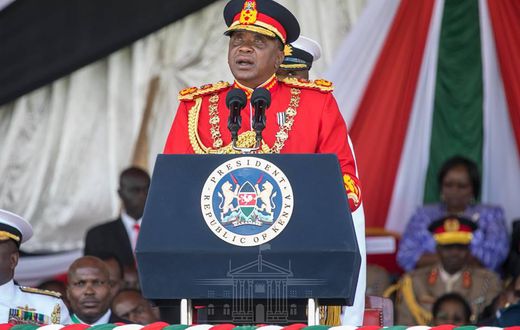 Uhuru dons a red Commander-in-Chief’s ceremonial military uniform (Courtesy)