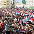 Supporters of separatists wave flags of the former South Yemen in the southern port city of Aden