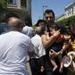 People at the scene of a blast that targeted police on the Tunisian capital's main avenue on Thursday