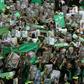 Supporters of then Iranian presidential candidate Mir Hossein Mousavi wave green flags - his campaign colour - at a pro-reform rally in Tehran on June 9, 2009