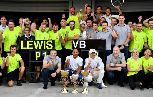 Lewis Hamilton and Valtteri Bottas celebrate with the Mercedes team after the Formula One Russian Grand Prix in Sochi