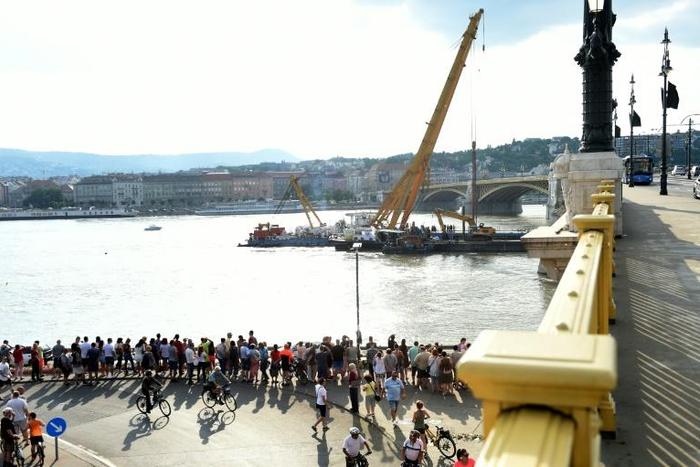 A police spokesman said Monday that the lifting operation could take six hours, and will be phased to allow divers to search the vessel for any victims still inside
