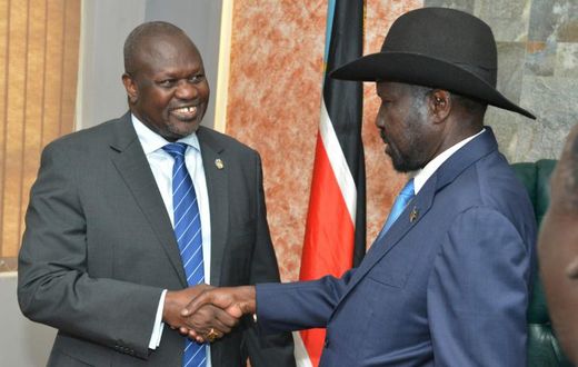South Sudan's President Salva Kiir (right) shake hands with rebel leader Riek Machar in a rare September 2019 meeting in Juba