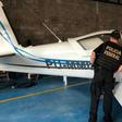 A federal police officer inspects an airplane seized during an anti drugs sweep in February 2019 at a hangar in Palmas, Tocatins state, central Brazil