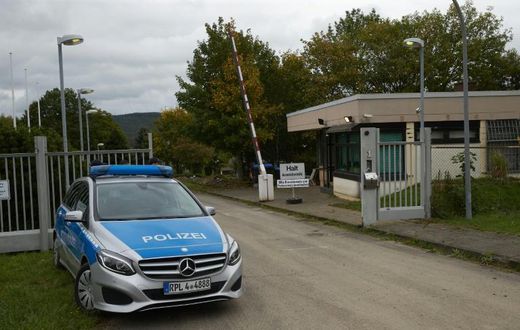 A police car stands in front of the grounds of a former NATO bunker in Traben-Trarbach, western Germany, where a so-called "Bulletproof Hoster" service was located
