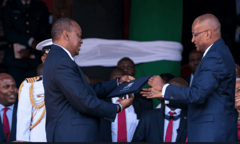 CBK Governor Patrick Njoroge presents the new generation notes to President Uhuru Kenyatta on 01 June 2019  during the Madaraka Day celebrations in Narok