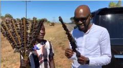 Larry Madowo eating Mouse