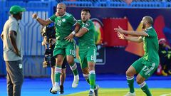 Midfielder Sofiane Feghouli (2nd-L) celebrates scoring for Algeria as Ivory Coast coach Ibrahim Kamara (L) looks on during an Africa Cup of Nations quarter-final in Egypt