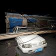 A car was crushed by a pole near the site of the explosion at the Henan Coal Gas Group factory in Yima city