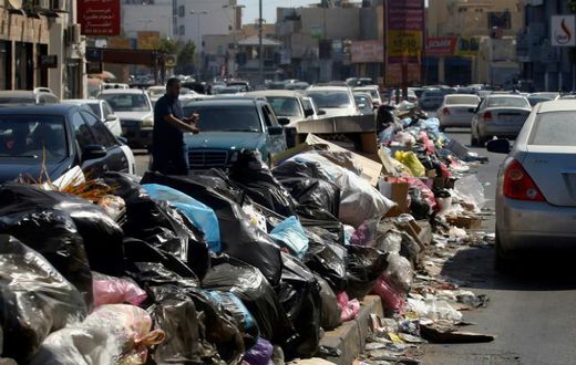 Across Libya's capitol Tripoli, tonnes of waste overflows from bins and piles up on roadsides