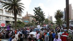 Kenyan opposition leader of the Coalition for Reforms and Democracy (CORD), Raila Odinga (C) leads his supporters during a protest near the premises hosting the headquarters of Independent Electoral and Boundaries Commission (IEBC) to demand the disban...