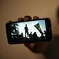 Sudanese protester Akram, who prefers to keep his identity hidden, shows a picture from a sit-in brutally cleared by men wearing military fatigues on June 3